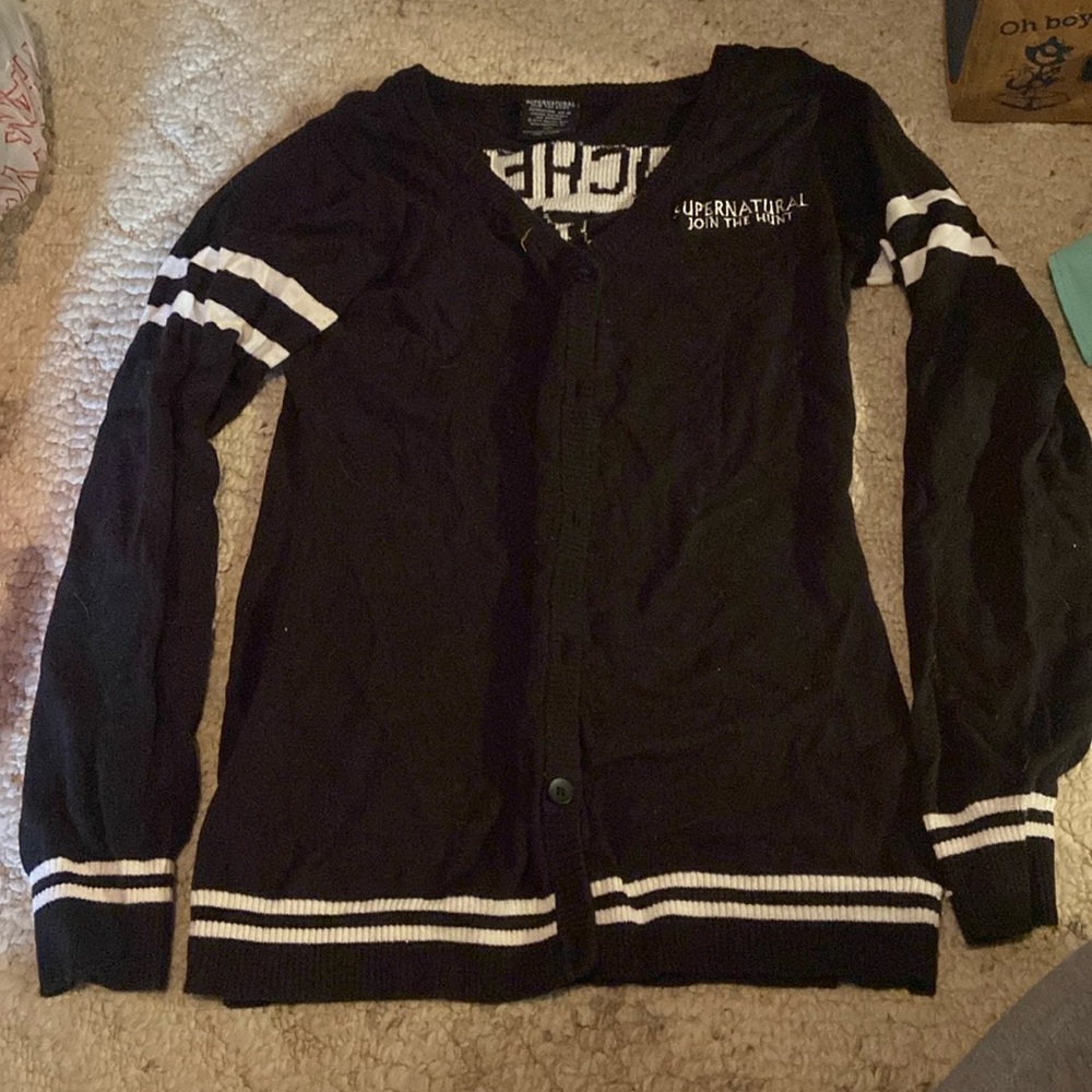 Supernatural black and white sweater in a size large (16).